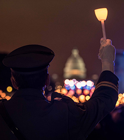 Police officer with lit candle