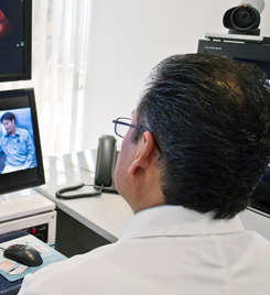 Clinician conducting a telemedicine forensic exam