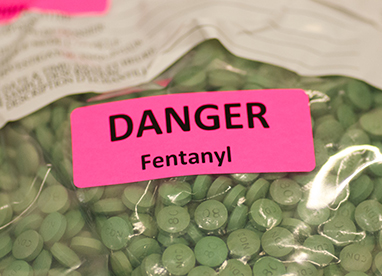 Plastic bag of green pills marked Fentanyl