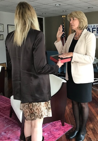 Principal Deputy Assistant Attorney General Katie Sullivan (left) swears in Kendel Ehrlich as the Director of the Office of Sex Offender Sentencing, Monitoring, Apprehending, Registering, and Tracking on March 16. 
