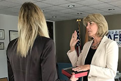 Kendel Ehrlich being sworn in as SMART Office Director