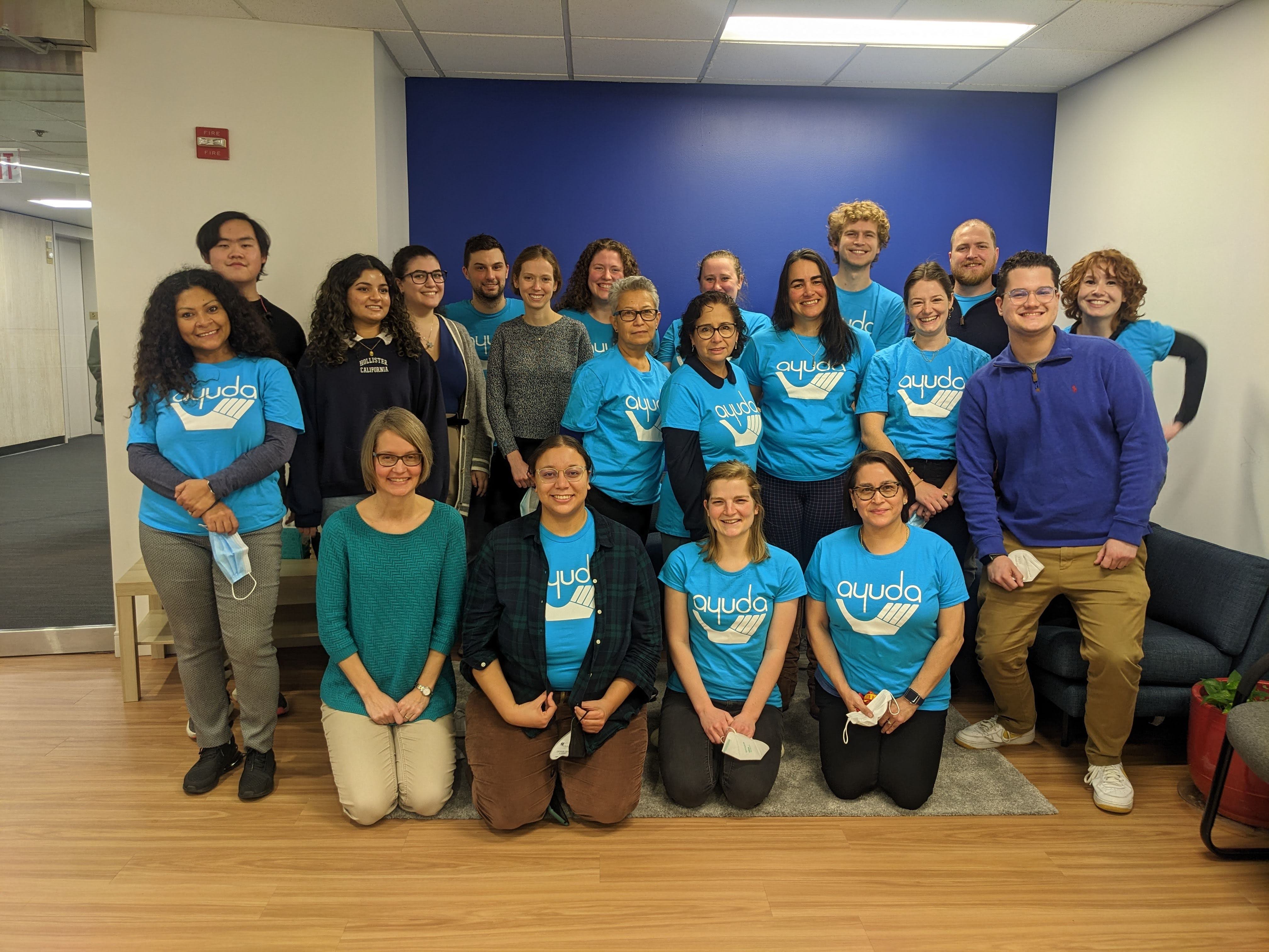 Group photo with most wearing t-shirt with the text ayuda