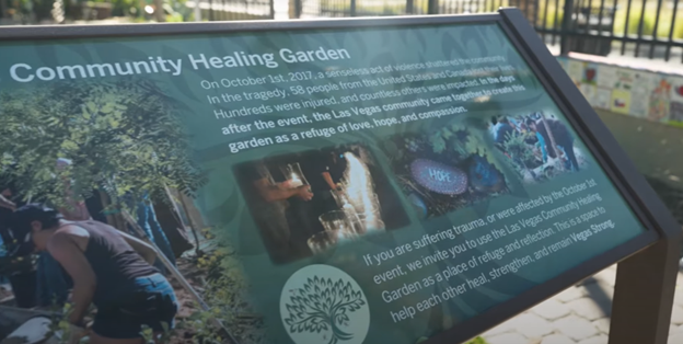 Informational sign about a Community Healing Garden, with text describing its purpose and small images of the garden.