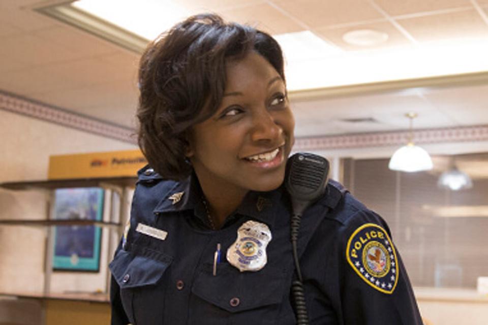 Smiling female officer in precinct