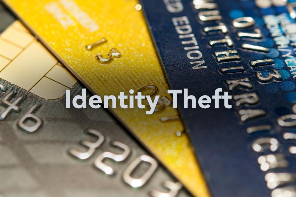 Identity Theft text on background of credit cards