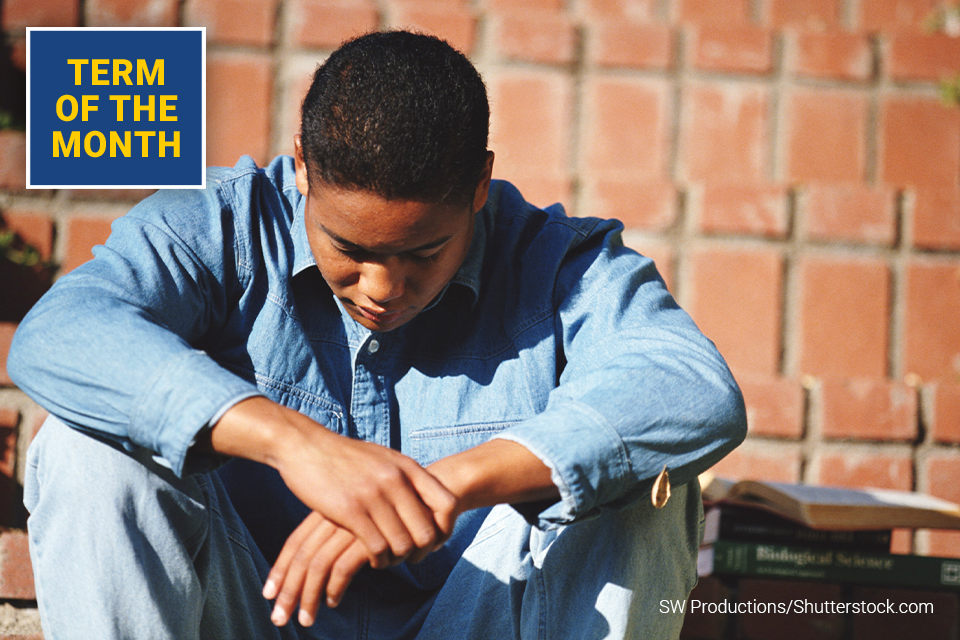 Photo of young man with head down