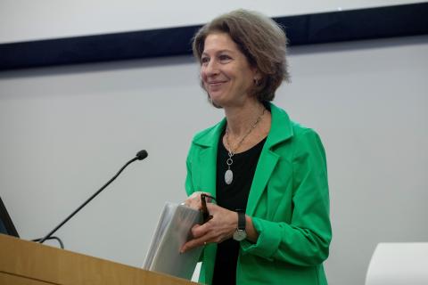 Amy L. Solomon at the podium